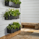 3 Modern Window Boxes on a wall mounted with brackets and bench in background