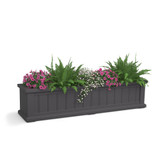Promenade Railing Planter  in gray with a mixture of green plants and flowers