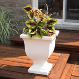 Julian Urn Planter - 2 Sizes, white decorative flower planter with colorful foliage on a wooden deck outdoor setting.