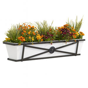 Medallion window box with white liner on white background with fall flowers