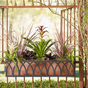 Arch Railing Planter, decorative outdoor garden planter with floral arrangement on a rusty metal railing.