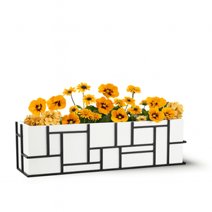 Mondrian Window Box, modern geometric flower planter with white and black design containing yellow flowering plants.