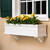 White Laguna Window Box with faux brackets mounted under a window that has shutters