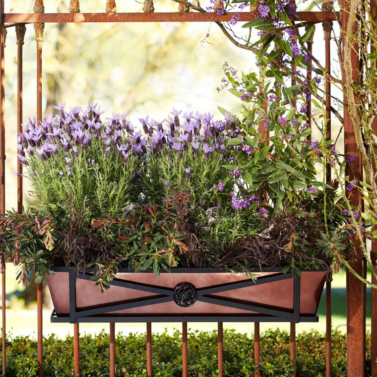 Medallion Railing Planter  with oil rubbed liner on an ornate railing planted with lavender