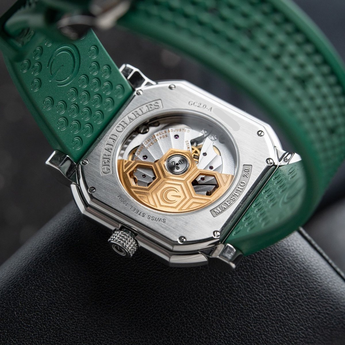 Caseback of the Gerald Charles Maestro 2.0 Ultra-Thin, engraved GERALD CHARLES, GC2.0-A, MAESTRO 2.0 and SWISS STEEL 100M, showing the Geneva-striped movement and a gold rotor cut with the GC monogram.
