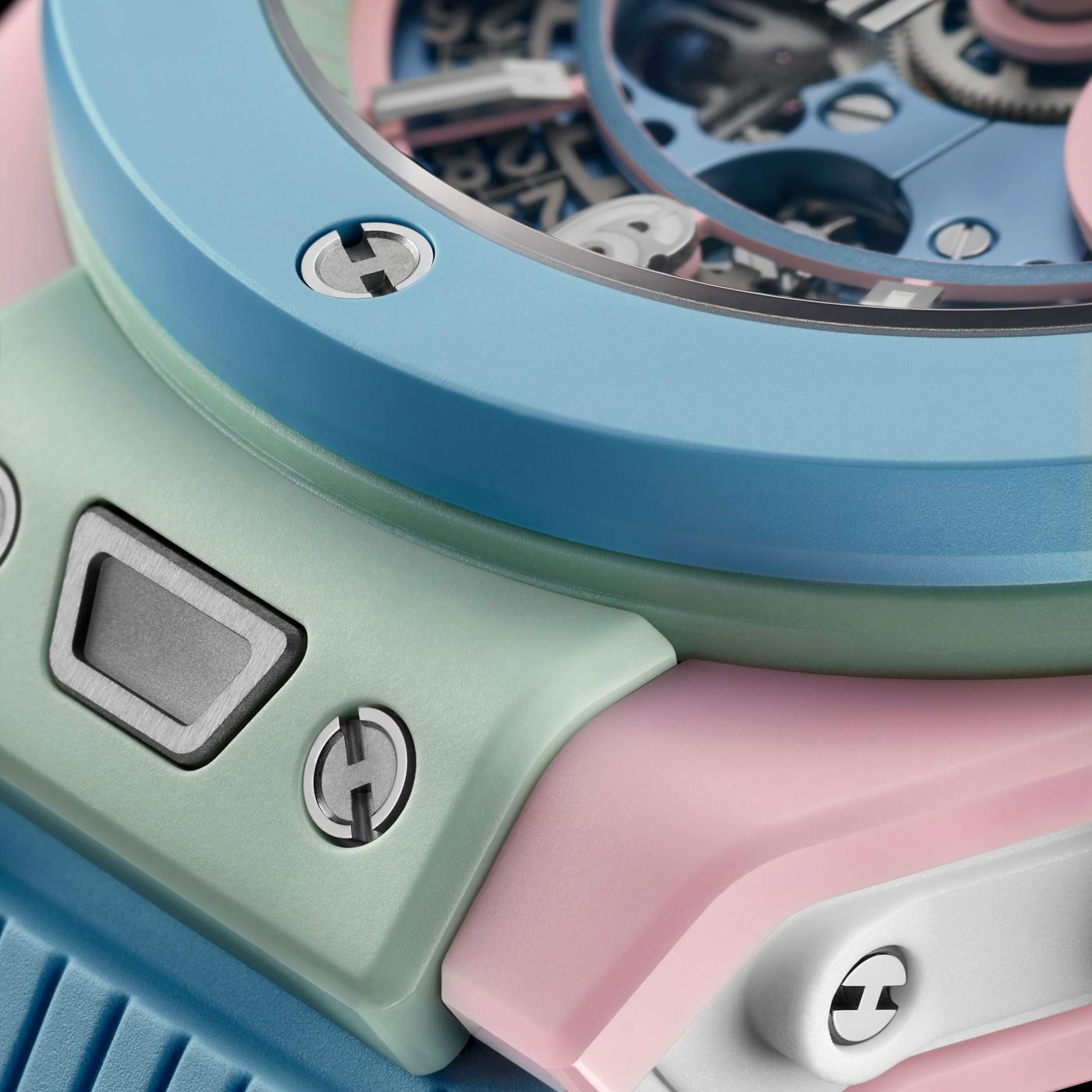 Extreme macro of the Big Bang Summer case junction showing pink, mint and sky-blue ceramic