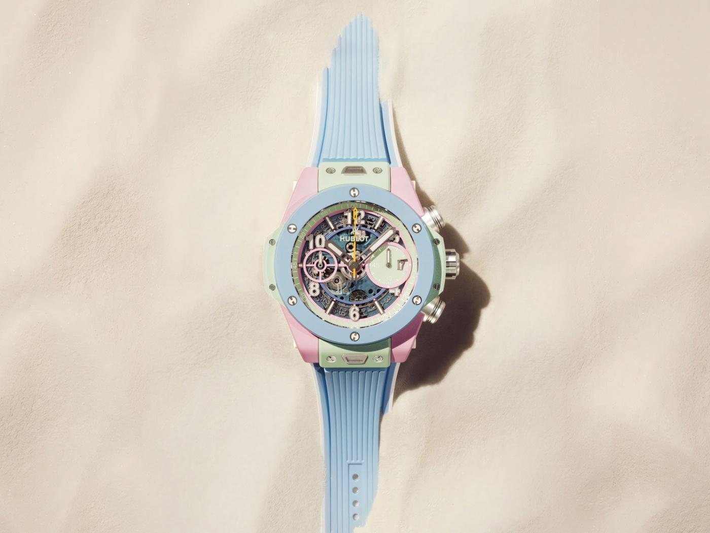 The Big Bang Summer flat lay showing the full watch and the sky-blue rubber strap