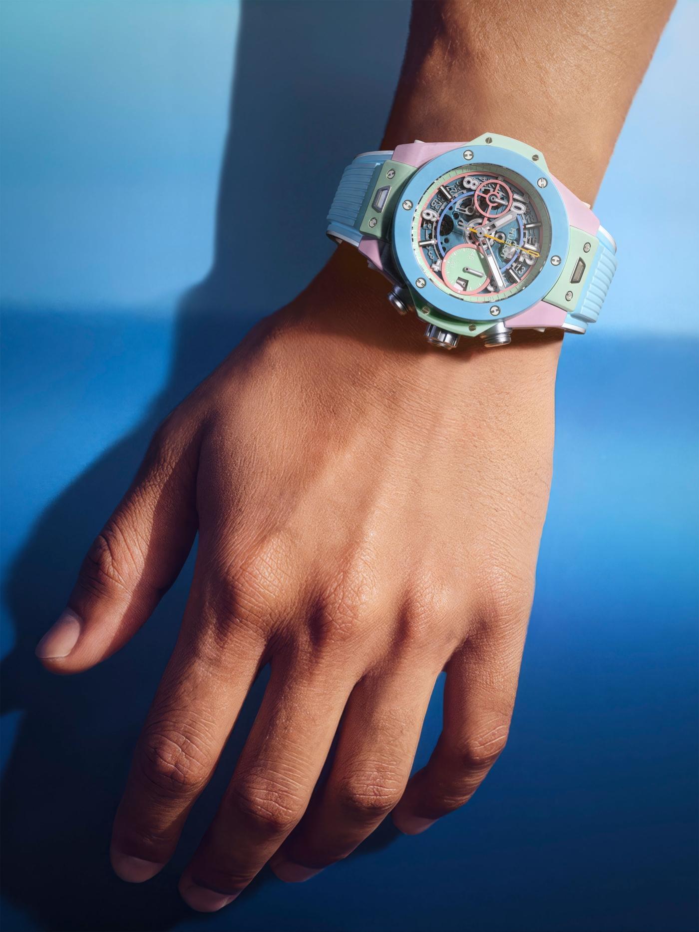 The Big Bang Summer on the wrist against a blue paper background