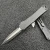 Automatic opening. 3.88" (9.86cm) closed. 2.63" (6.68cm) two-tone finish double edge CPM MagnaCut stainless dagger blade. Black aluminum handle. Glass breaker. Lanyard hole. Pocket clip. Frag pattern handle. Boxed.