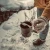 Station IX 007 Trail Ultra knife in snowy outdoor survival use on camping cup