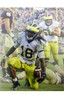 SOLD 979 Denard Robinson Autographed Kneeling vs. Notre Dame 16x20