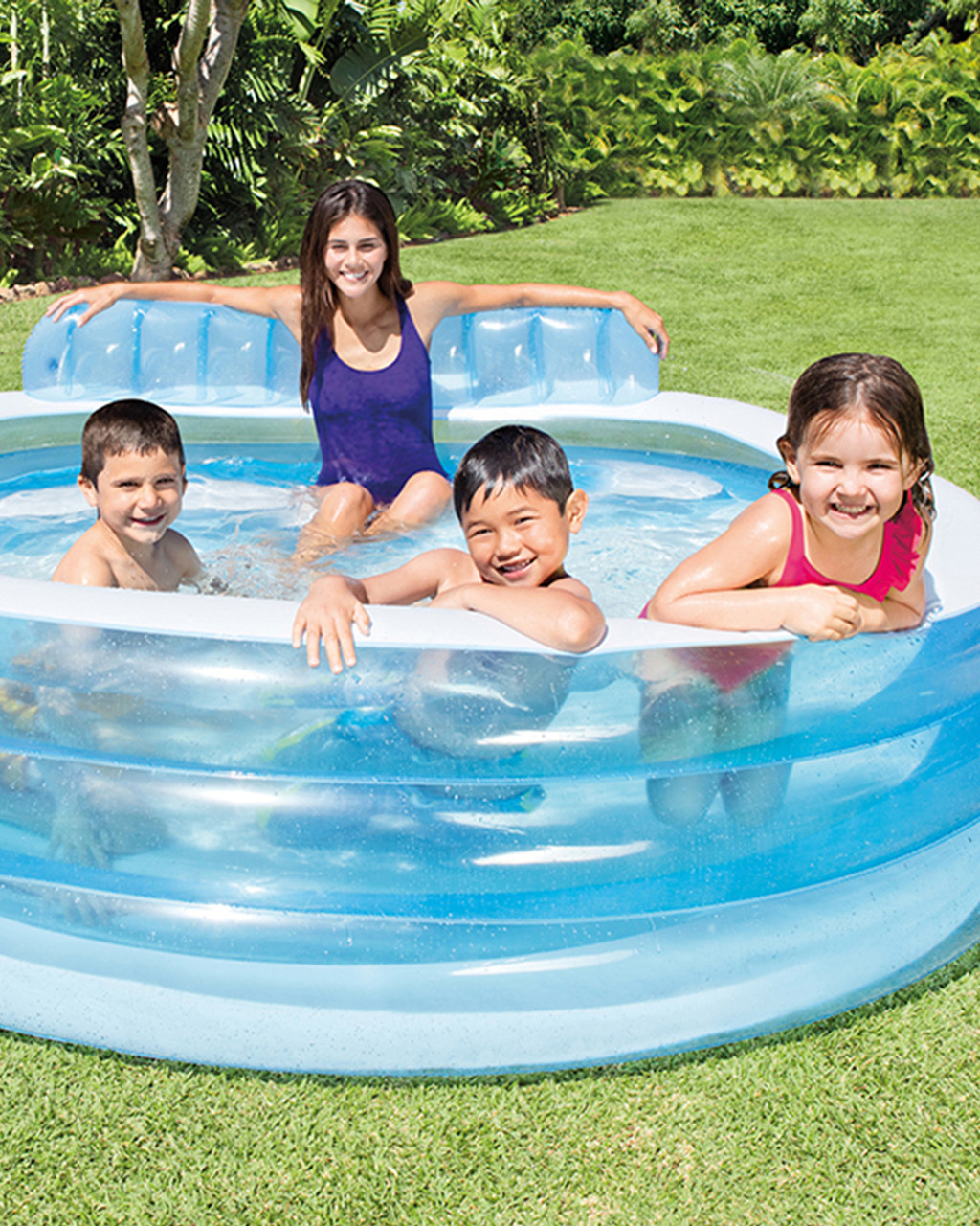 Colorful bottles floating in childs inflatable swimming pool