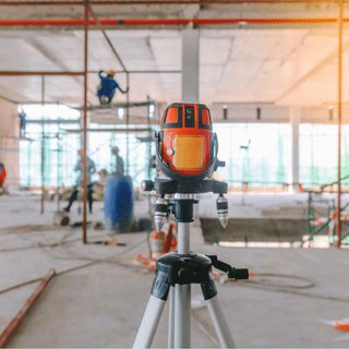 Tripod laser located within a construction site