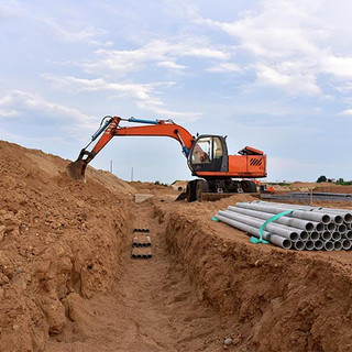 Excavator dig the trenches at a construction site.