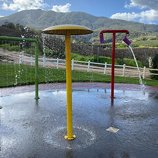 Water play park with mountain backdrop