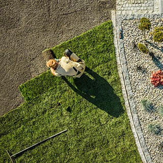 Aerial view of gardener installing brand new grass