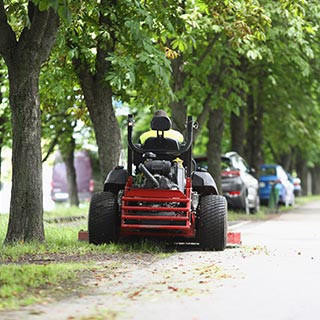 Mowing grass in a city park