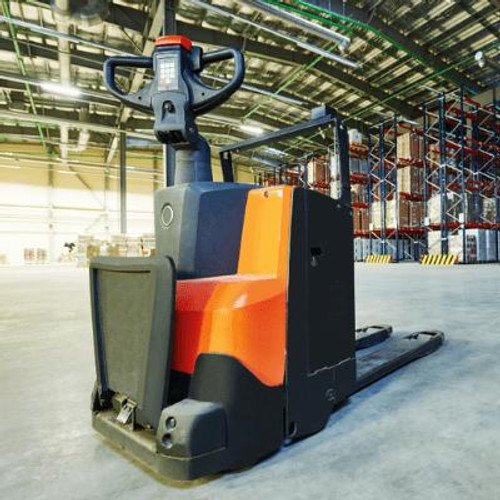 Orange pedestrian operated forklift in a warehouse.