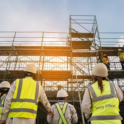 Project Managers and safety officer in spec steel truss structure scaffolding risk analysis in construction site