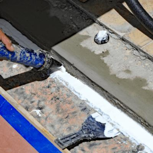 Worker doing grouting work