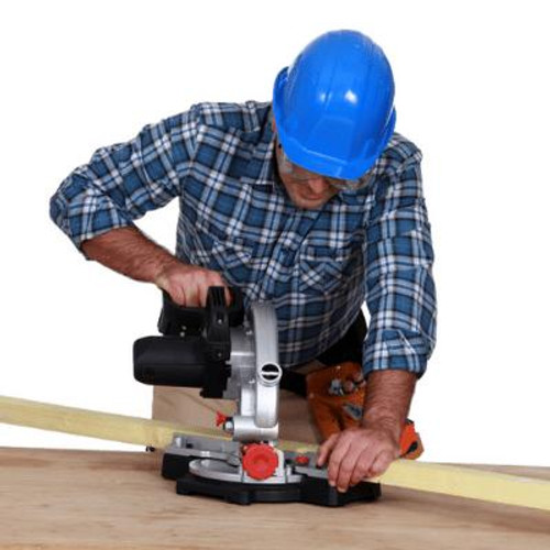 Man using  mitre/drop saw.