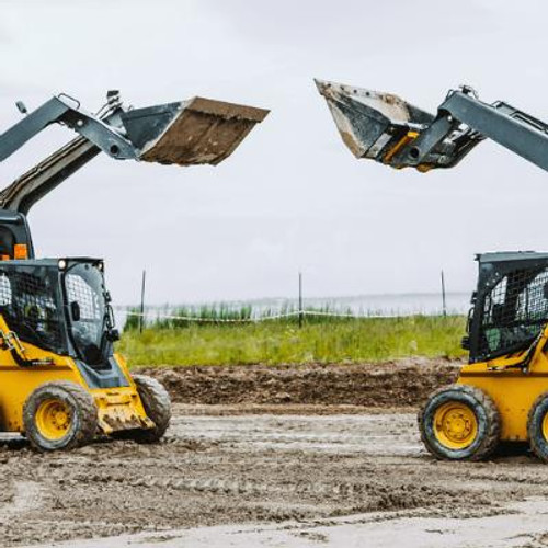 Two skid steers