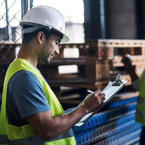 Contractor conducting inspection and noting down on form