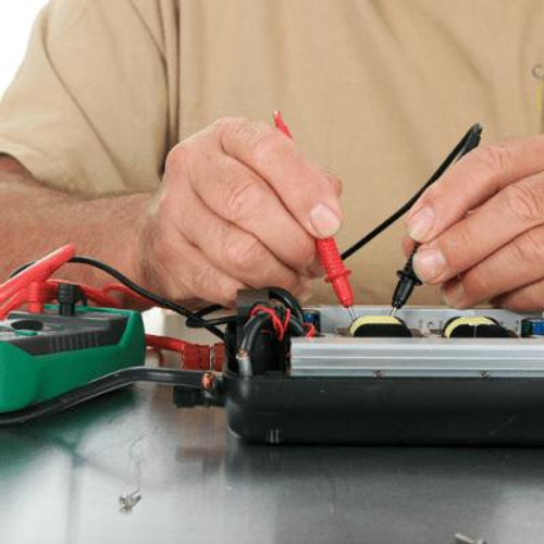 Man working on Electrical Equipment