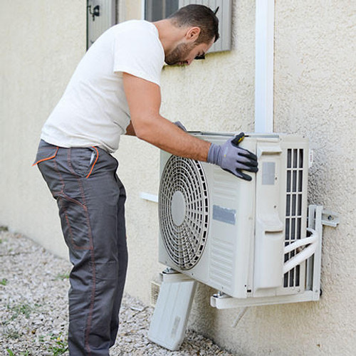 Electrician installing an air conditioning
