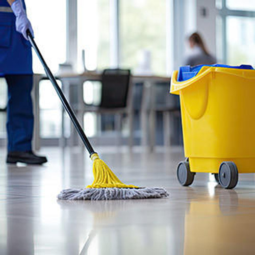 Cleaner mopping an office floor