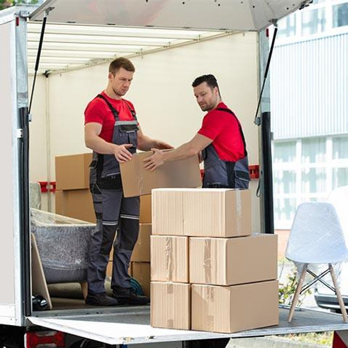 Removalists unloading and stacking boxes on moving truck