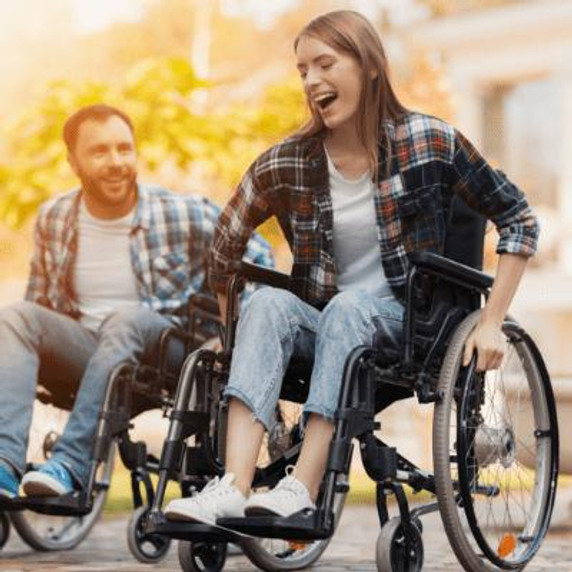 A man and women in a wheelchair.