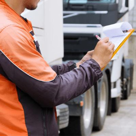 Driver completing a checklist prior to operating a vehicle.