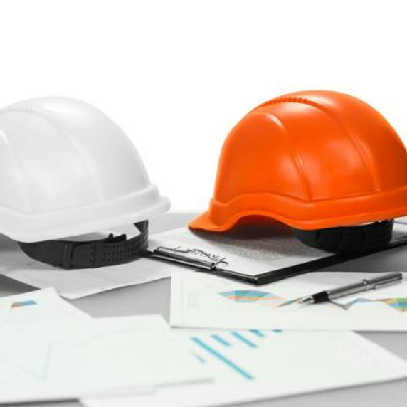 Orange and white Hardhat, clipboards, pen.