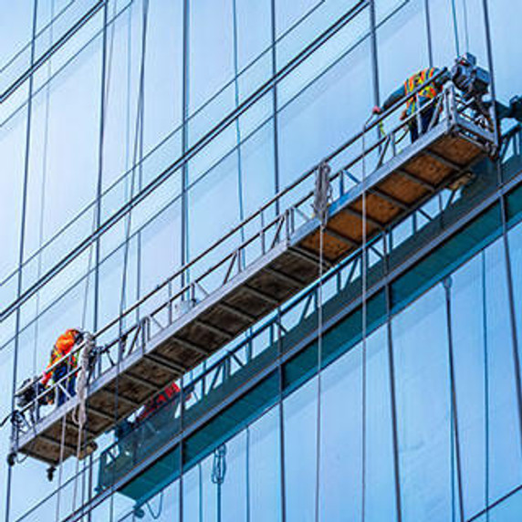 Professional high rise window cleaning service workers in gondola