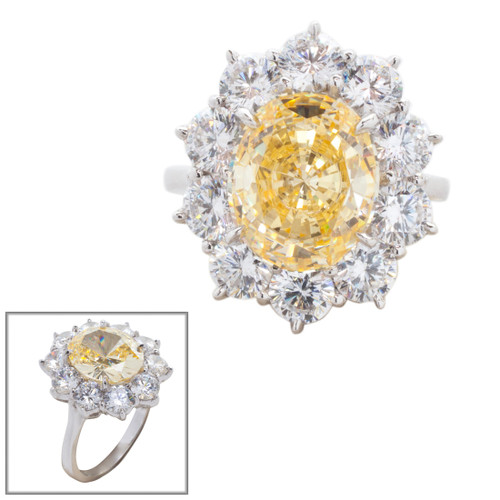 4.5ct Oval Cut Center surrounded by 12 Round Cut Stones of 2.5 TCW. Center stone size: 12x10mm F233-CAN-CZ-14K