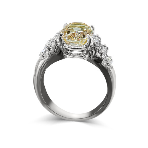 Wide Shank 3.25ct Oval Cut Center  with 3 Step Baguette Cut on each side of .75ct. Center stone size: 12x7.75mm