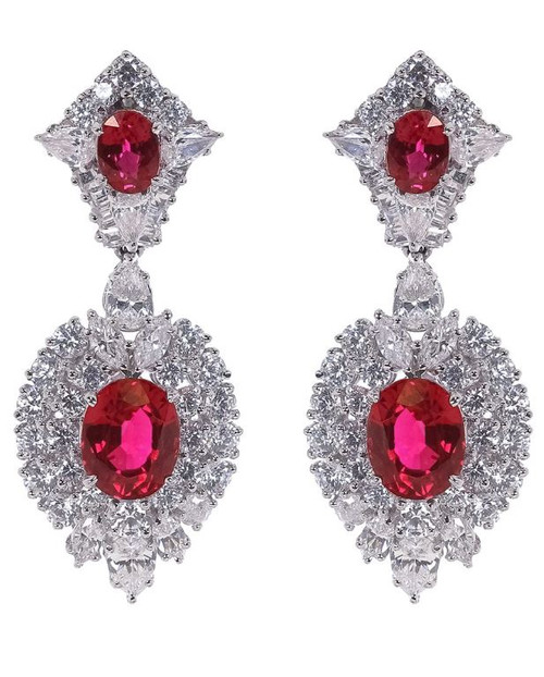 OVAL TOP SURR BY ROUND W/ LARGE OVAL BTTM SURR BY ROUNDS