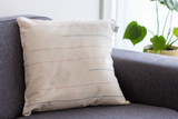 Premium cotton elegant pillow with True Indigo, Pink, and Yellow Natural pigments on sofa