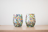 Hand-blown glass with playful coloured dots. A fun item to decorate your table and to give it a cozy touch.