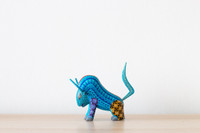 Wood hand carved bull Alebrije on a table