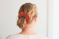 Model girl wearing a colourful handmade scrunchie.