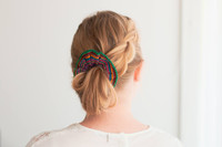 Cute girl wearing a colourful handmade scrunchie.