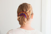 Pretty girl wearing a colourful handmade scrunchie.