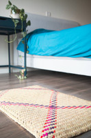 Handwoven Palm mat on bed room