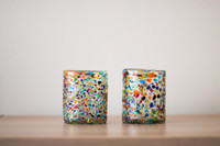 Hand-blown glass with playful coloured dots. A fun item to decorate your table and to give it a cozy touch.
