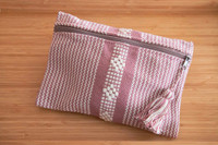 Beautiful pouch with unique patterns was made by hand using a waist loom. 
It is the perfect accessory for your cards, bills, coins, keys, or medium items. It can be used as a toiletry bag. With its ideal size, you can easily carry it on hand. Pouch soft pink
