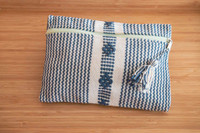 Beautiful pouch with unique patterns was made by hand using a waist loom. 
It is the perfect accessory for your cards, bills, coins, keys, or medium items. It can be used as a toiletry bag. With its ideal size, you can easily carry it on hand. Pouch white and blue