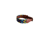 Handmade collar with colourful patterns woven by hand by artisans in Mexico. Handmade collar with colourful patterns woven by hand by artisans in Mexico.
Your furry friend will love this beautiful and unique collar. Medium dog collar blue, green, yellow