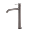 Product image of the Kaya Tall Basin Mixer in gun metal.  Tall round body with pin handle and slightly bent round spout.